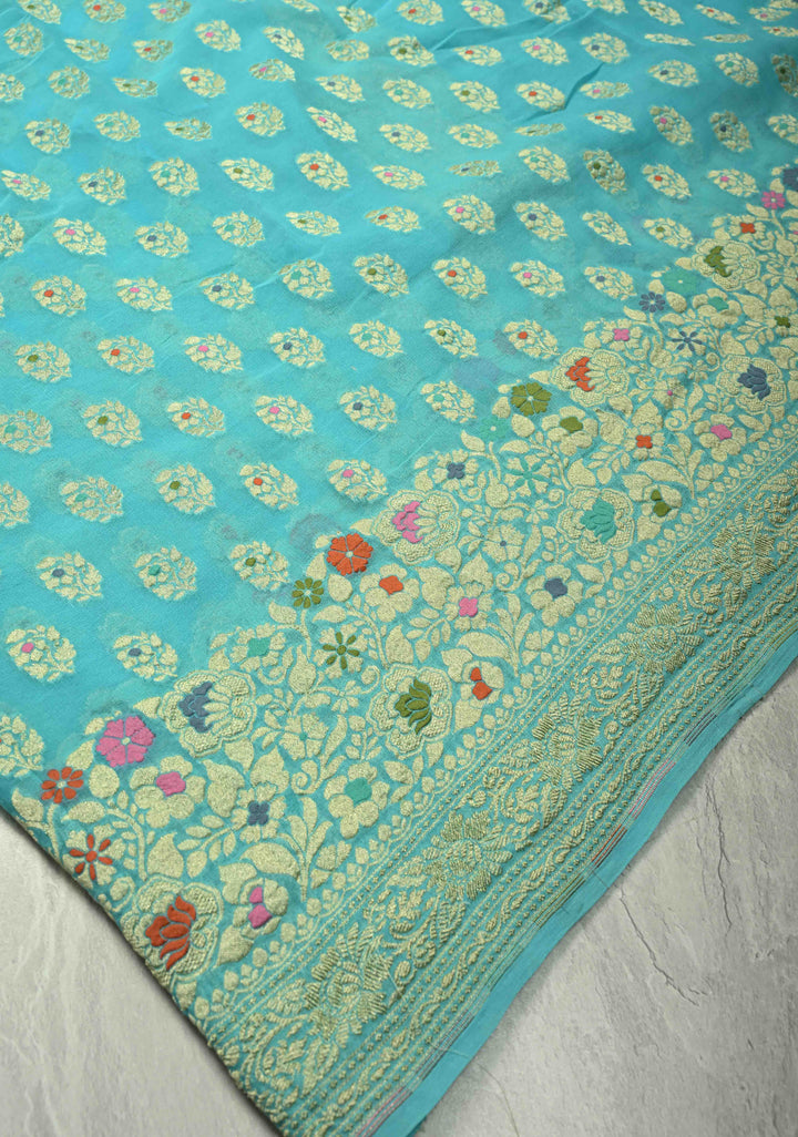 Authentic Turquoise Meenakari Work on Banarasi Silk Georgette Saree with Floral Buttas and 2 Side Equal Ornate Skirt Border | SILK MARK CERTIFIED