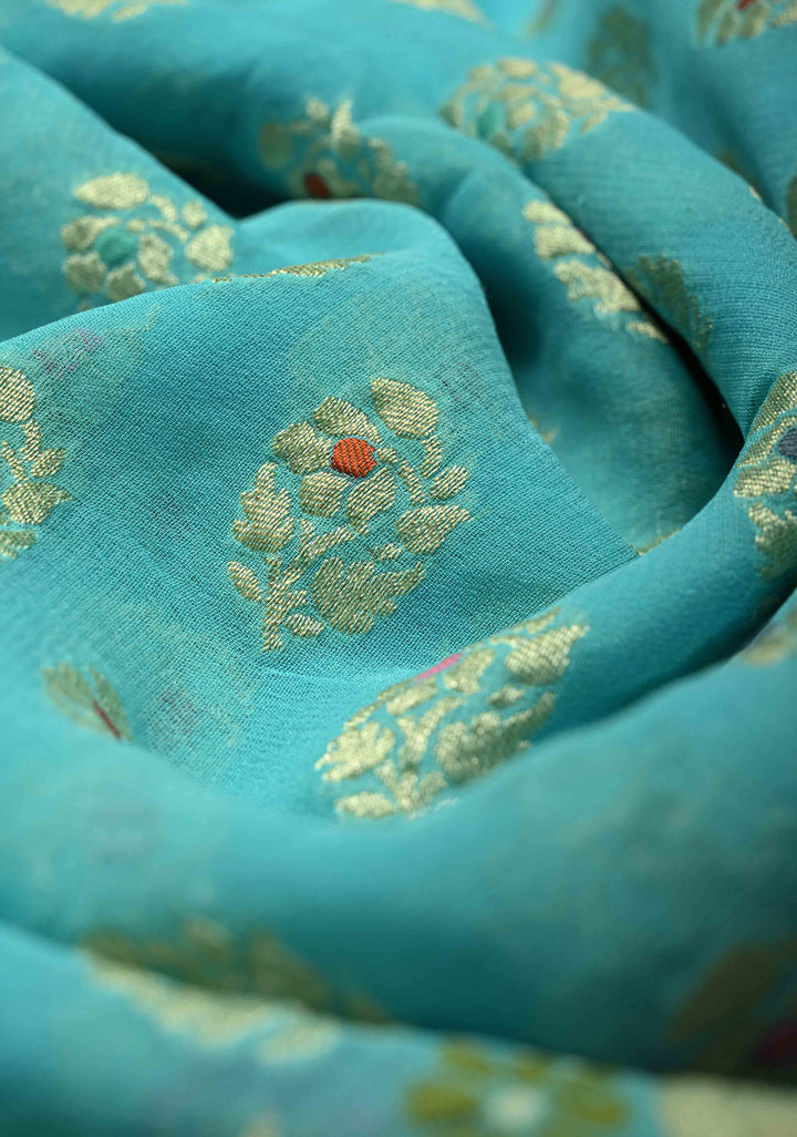 Authentic Turquoise Meenakari Work on Banarasi Silk Georgette Saree with Floral Buttas and 2 Side Equal Ornate Skirt Border | SILK MARK CERTIFIED