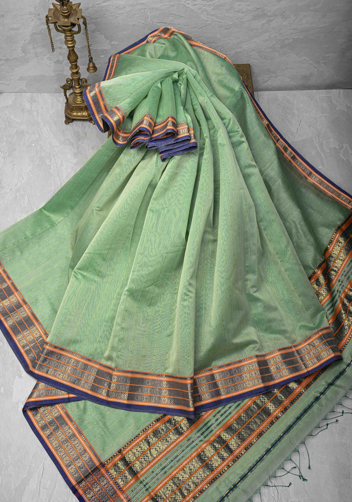 Mint Green Handwoven Maheshwari Silk Cotton Saree with Muted Stripes And Zari Border