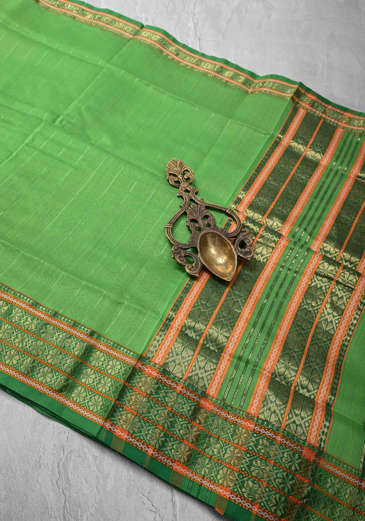 Parrot Green Handwoven Maheshwari Silk Cotton Saree with Muted Stripes and Zari Borders
