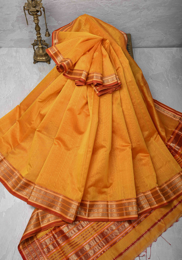 Mustard Yellow Handwoven Maheshwari Silk Cotton Saree with Muted Stripes and Zari Borders