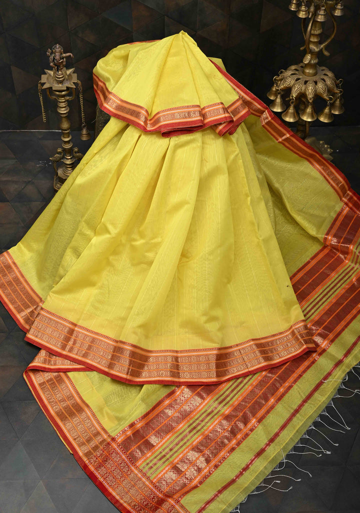Yellow Handwoven Maheshwari Silk Cotton Saree with Muted Stripes and Zari Border