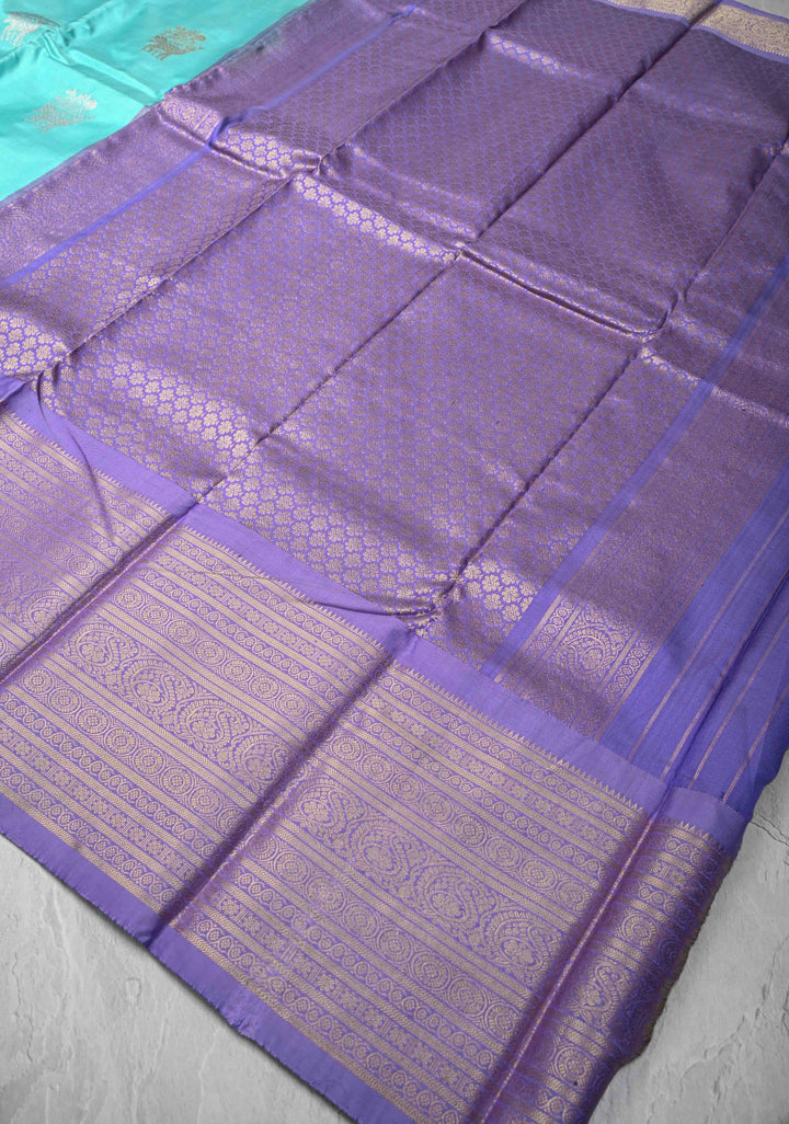 Aqua Blue Ikkat Kanjivaram Fusion Silk Saree with Gold-Silver Buttas and Contrast Zari Border | SILK MARK CERTIFIED