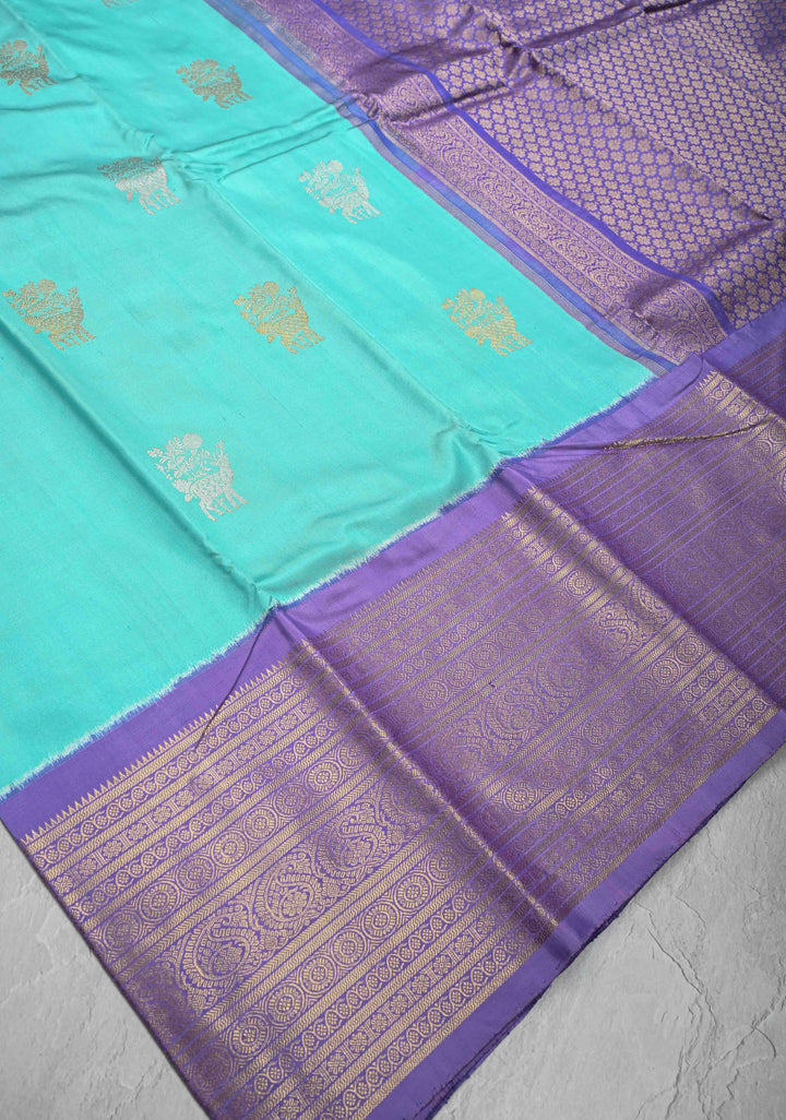 Aqua Blue Ikkat Kanjivaram Fusion Silk Saree with Gold-Silver Buttas and Contrast Zari Border | SILK MARK CERTIFIED