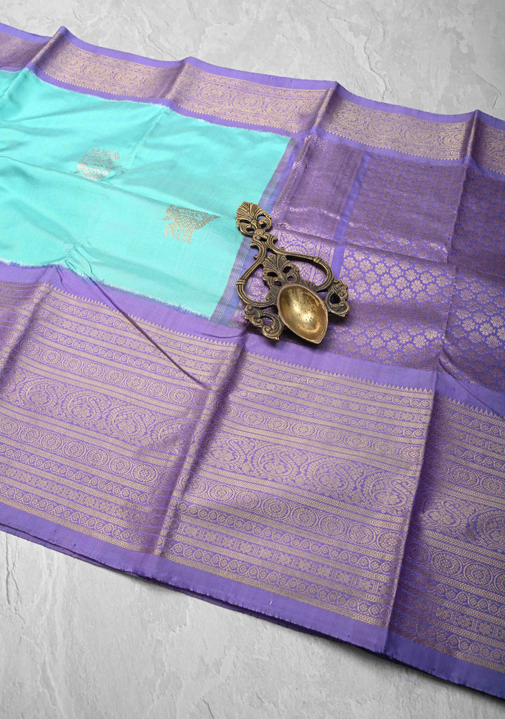 Aqua Blue Ikkat Kanjivaram Fusion Silk Saree with Gold-Silver Buttas and Contrast Zari Border | SILK MARK CERTIFIED