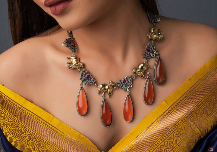 Fusion Dual Tone Jewelry with Pichwai Cow Units and burnt orange Stones | Shobitam Jewelry
