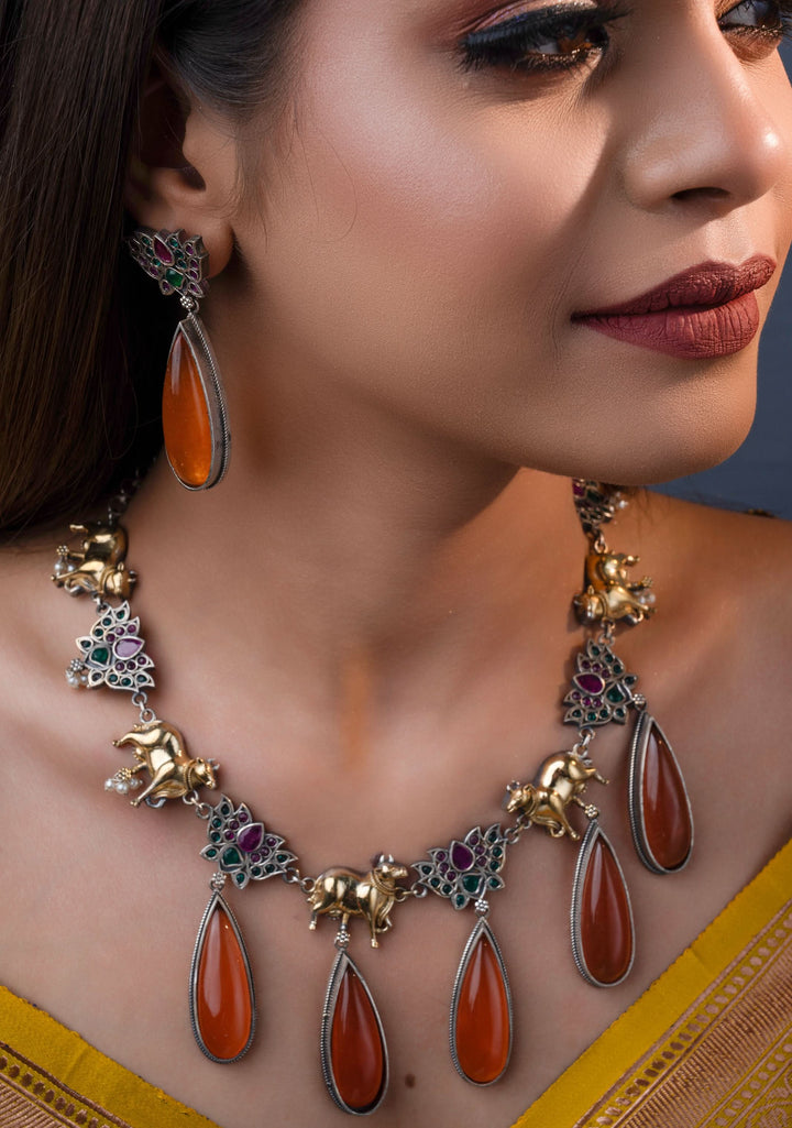 Fusion Dual Tone Jewelry with Pichwai Cow Units and burnt orange Stones | Shobitam Jewelry