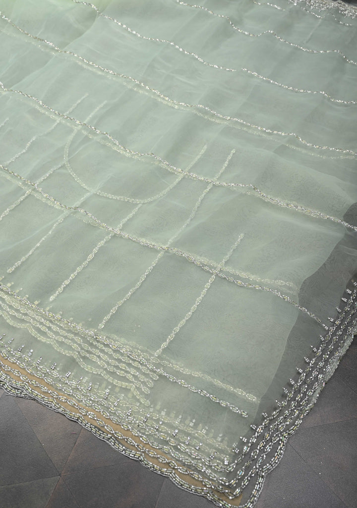 Dewy Pista Green Organza Saree with Horizontal Stripes Cutdana and Beads Embroidery Scallop Border