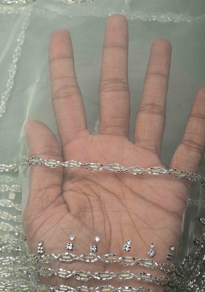 Dewy Pista Green Organza Saree with Horizontal Stripes Cutdana and Beads Embroidery Scallop Border