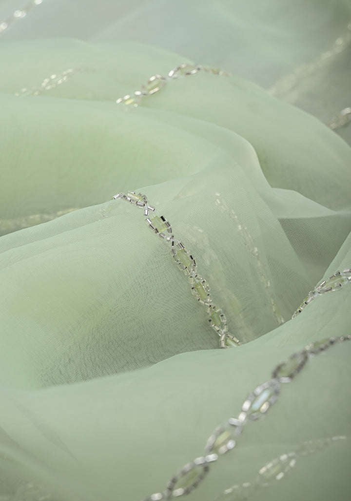 Dewy Pista Green Organza Saree with Horizontal Stripes Cutdana and Beads Embroidery Scallop Border