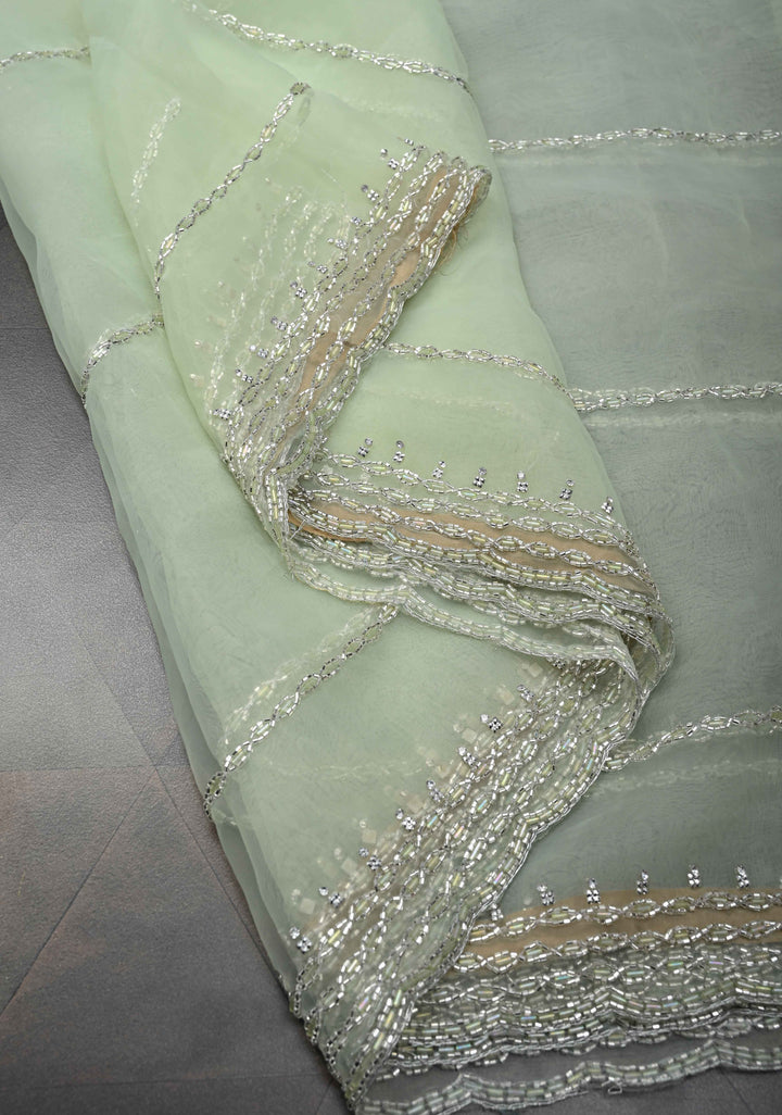 Dewy Pista Green Organza Saree with Horizontal Stripes Cutdana and Beads Embroidery Scallop Border