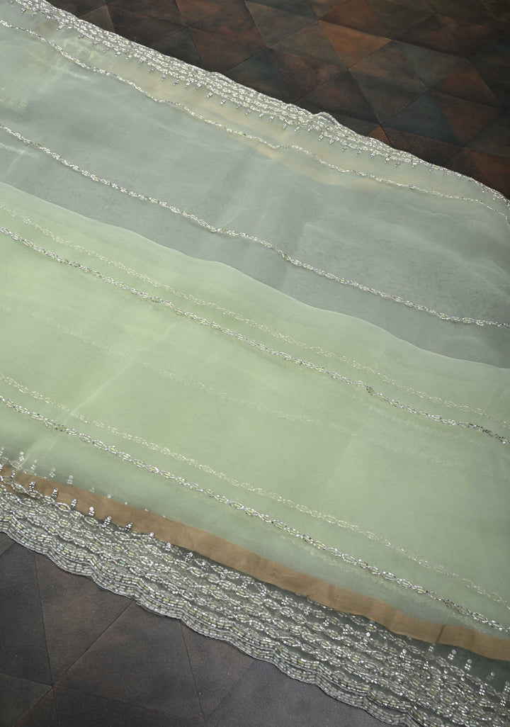 Dewy Pista Green Organza Saree with Horizontal Stripes Cutdana and Beads Embroidery Scallop Border