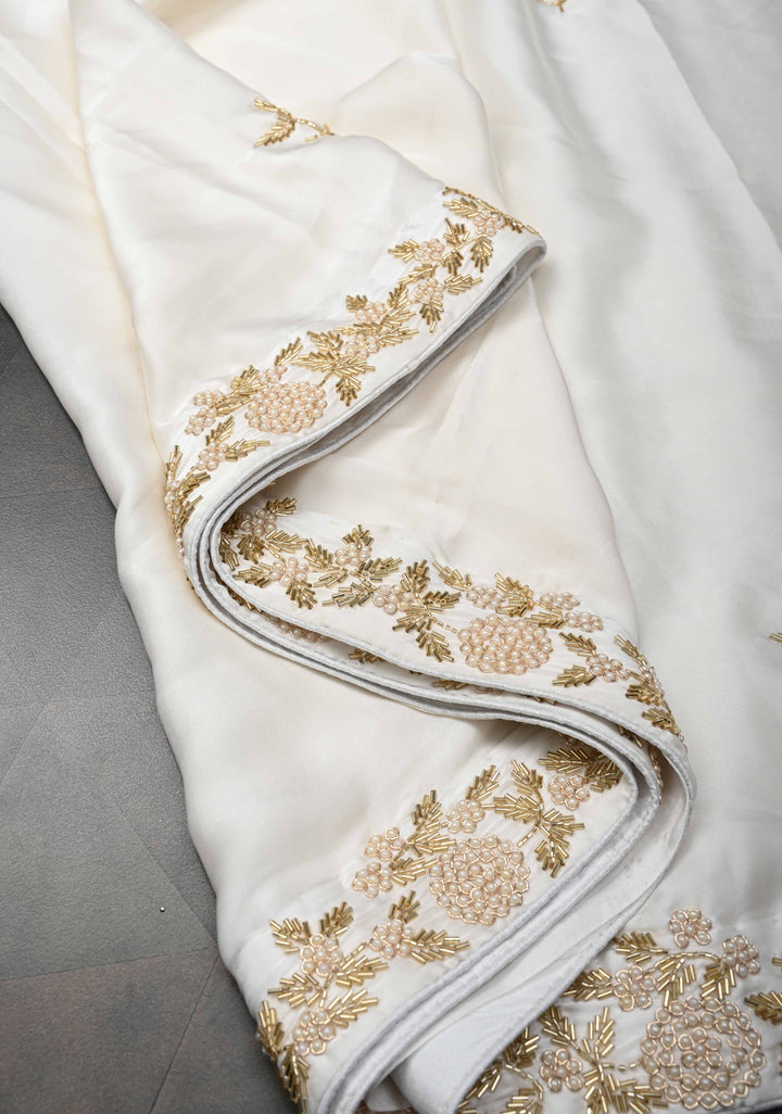 Ivory satin georgette Saree with sequins and Moti work Buttas and Boder