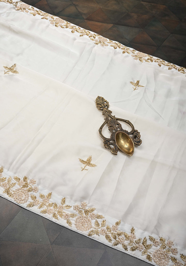 Ivory satin georgette Saree with sequins and Moti work Buttas and Boder