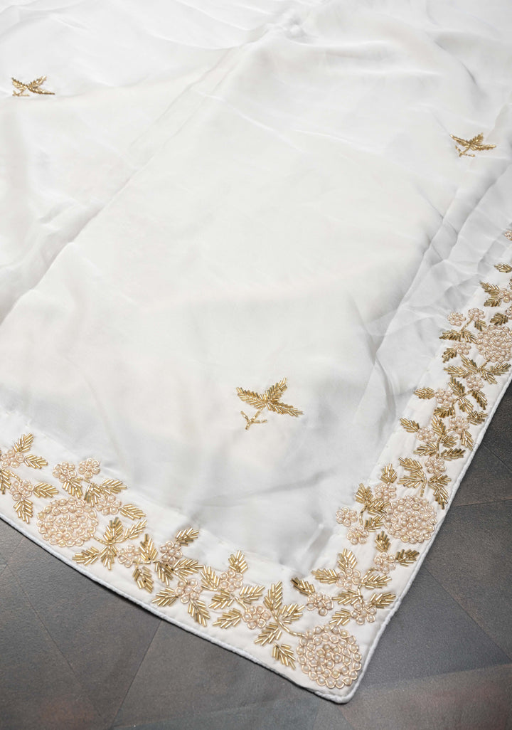 Ivory satin georgette Saree with sequins and Moti work Buttas and Boder