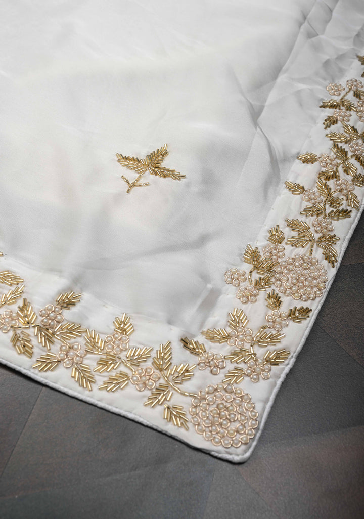 Ivory satin georgette Saree with sequins and Moti work Buttas and Boder