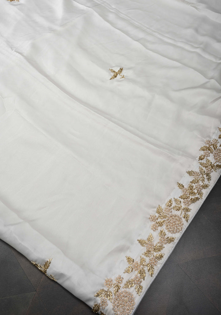 Ivory satin georgette Saree with sequins and Moti work Buttas and Boder