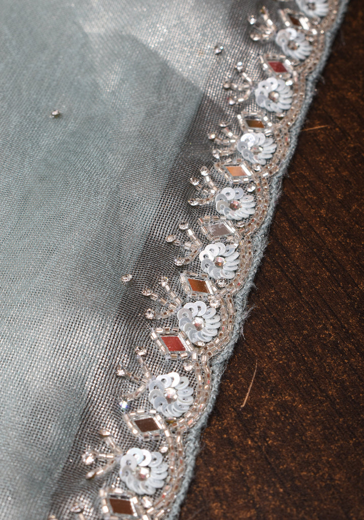 Powder Blue Tissue Saree with sequins, cutdana, mirror work and scalloped Borders