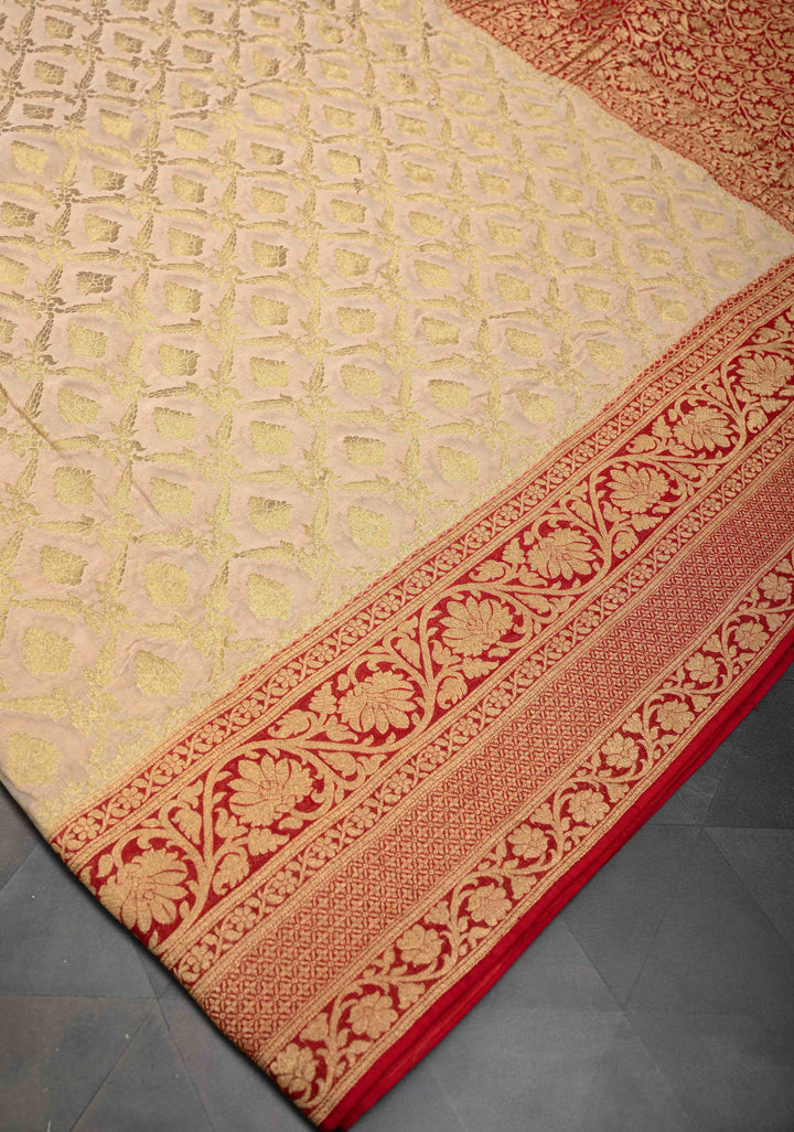 Beige Georgette Silk Banarasi Floral Jaal Saree with Contrast Red Zari Border
