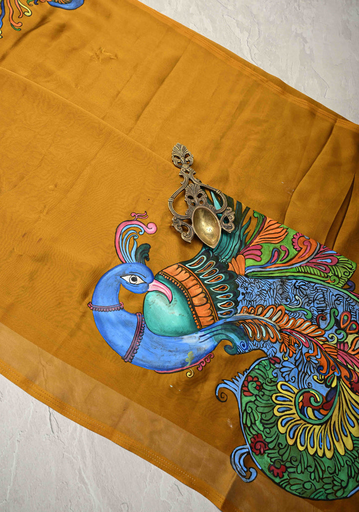 Ochre yellow on Shimmer Georgette Saree with Hand paint Peacock Motifs