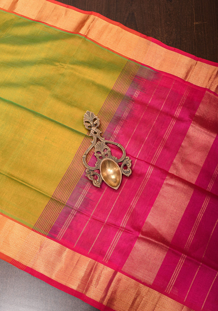 Kanchi Silk Cotton in Dual tone Green and Yellow with Zari Border
