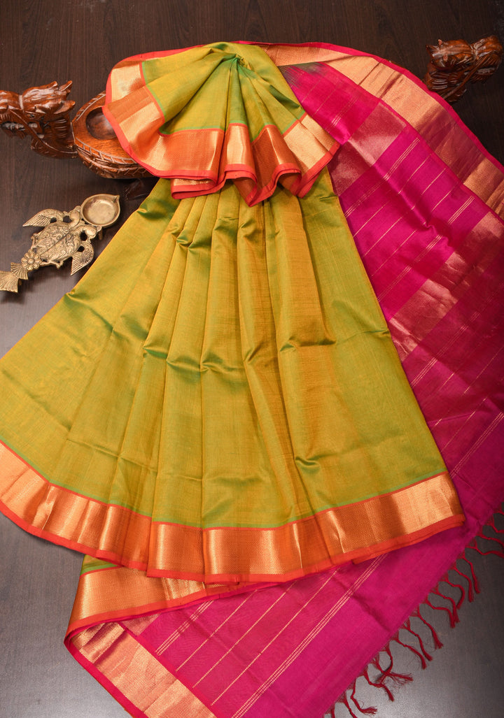 Kanchi Silk Cotton in Dual tone Green and Yellow with Zari Border
