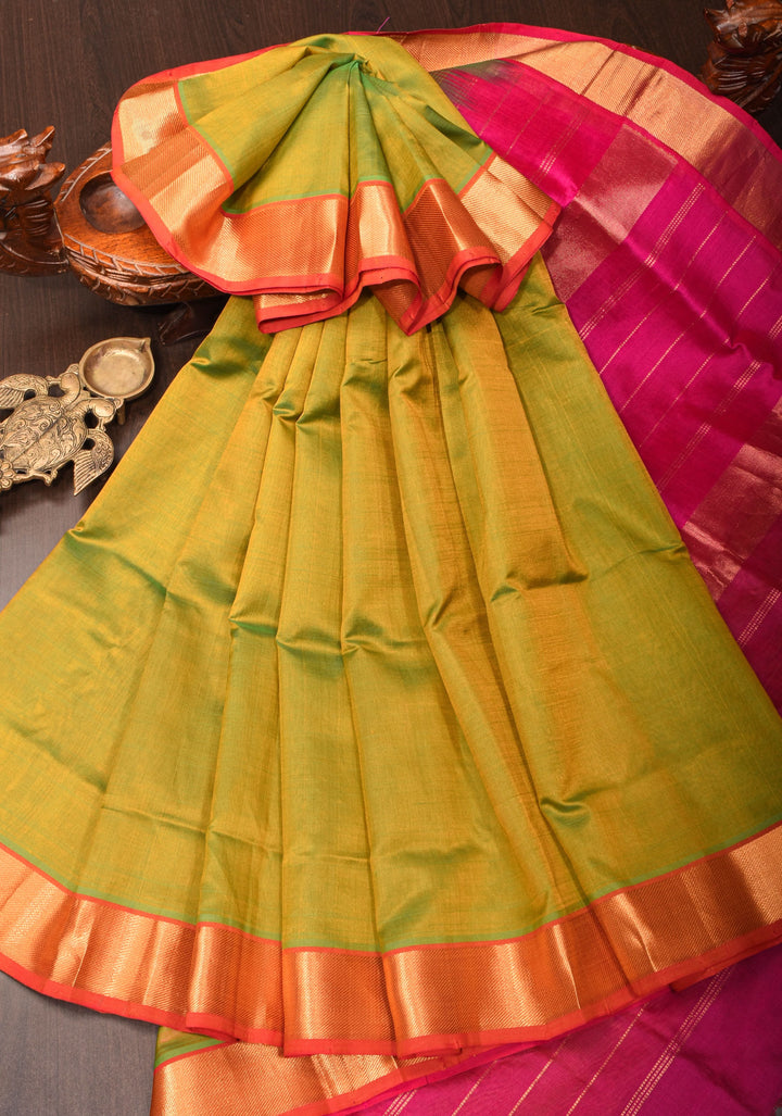 Kanchi Silk Cotton in Dual tone Green and Yellow with Zari Border