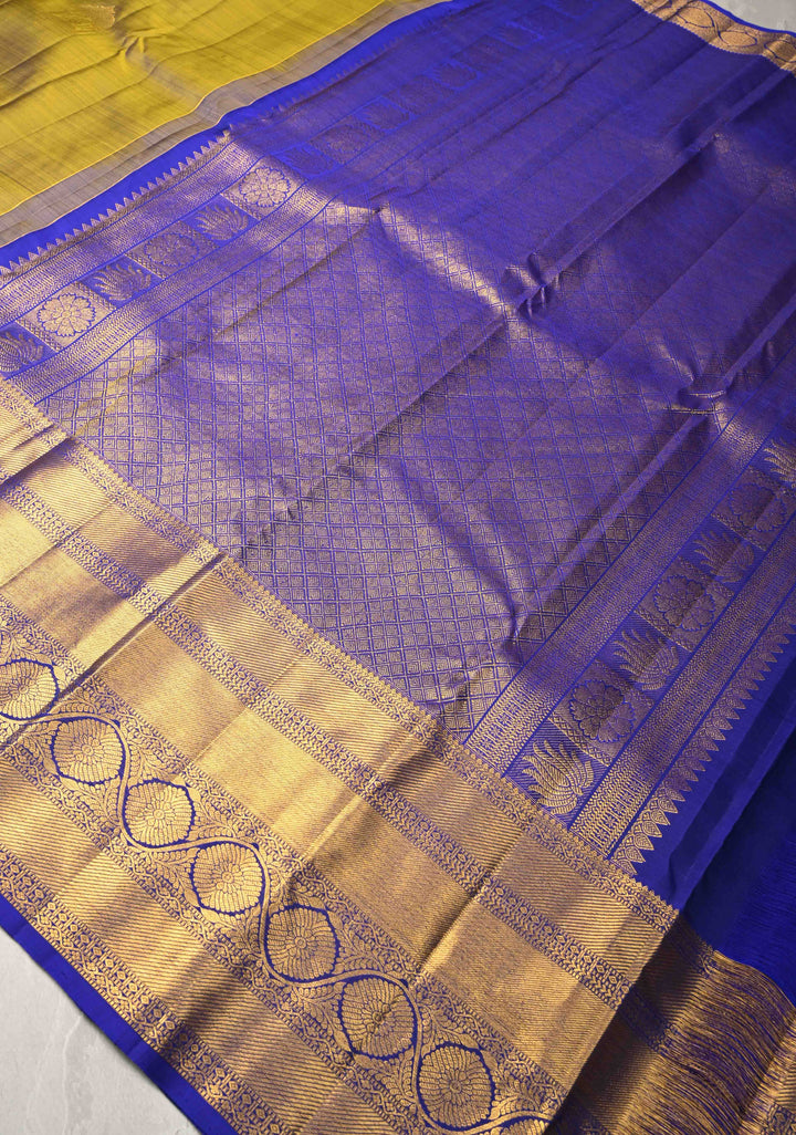 1 Gram Gold Zari Moss Green-Purple Dual tone Pure Kanjivaram Silk Saree with Arch Motifs and Wide Zari Border | SILK MARK CERTIFIED