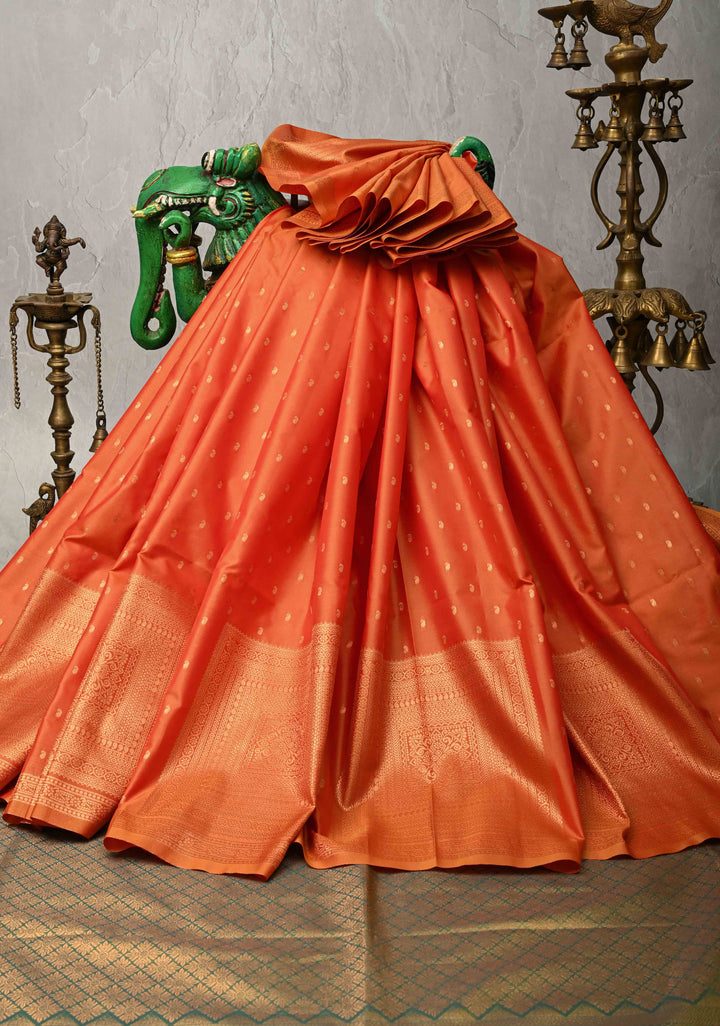 Orange Kanchi Semi Silk Saree with Paisley Zari Buttas and Geomatric Motifs on Border