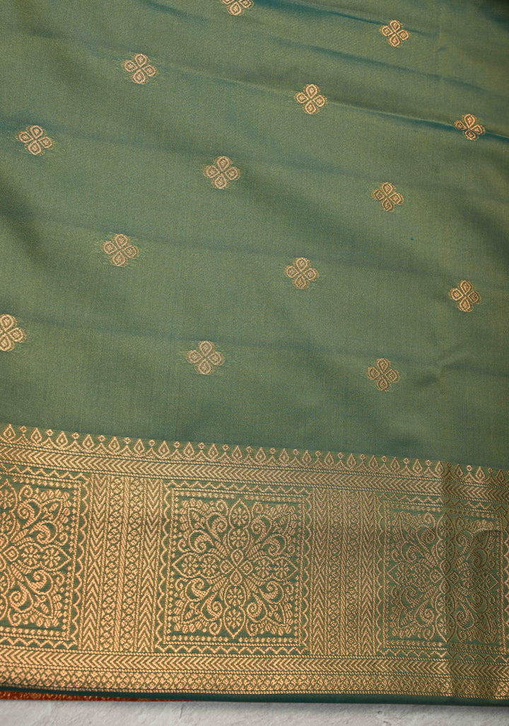 Orange Kanchi Semi Silk Saree with Paisley Zari Buttas and Geomatric Motifs on Border