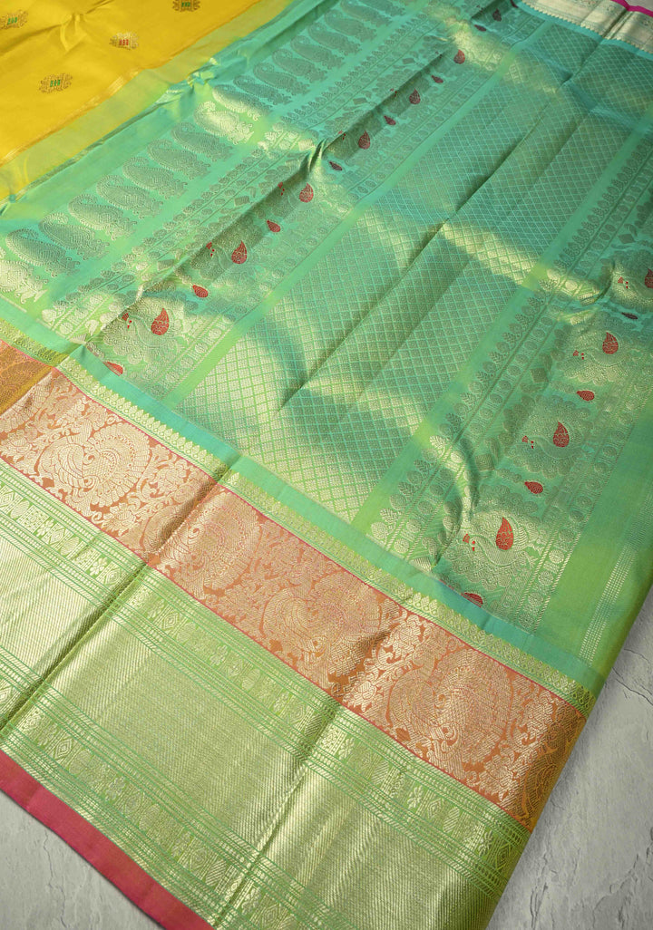 Yellow Gadwal Handwoven Pure Silk Saree with Meenakari Rangoli Zari Buttas with Pink and Teal Border | SILK MARK CERTIFIED