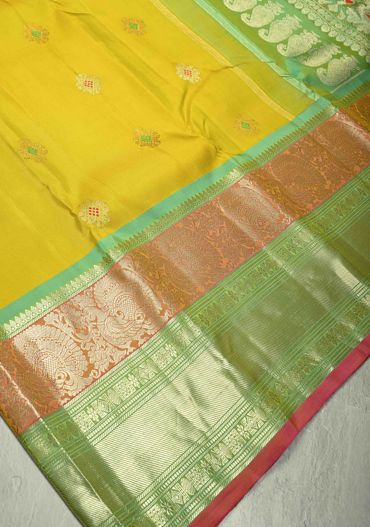Yellow Gadwal Handwoven Pure Silk Saree with Meenakari Rangoli Zari Buttas with Pink and Teal Border | SILK MARK CERTIFIED