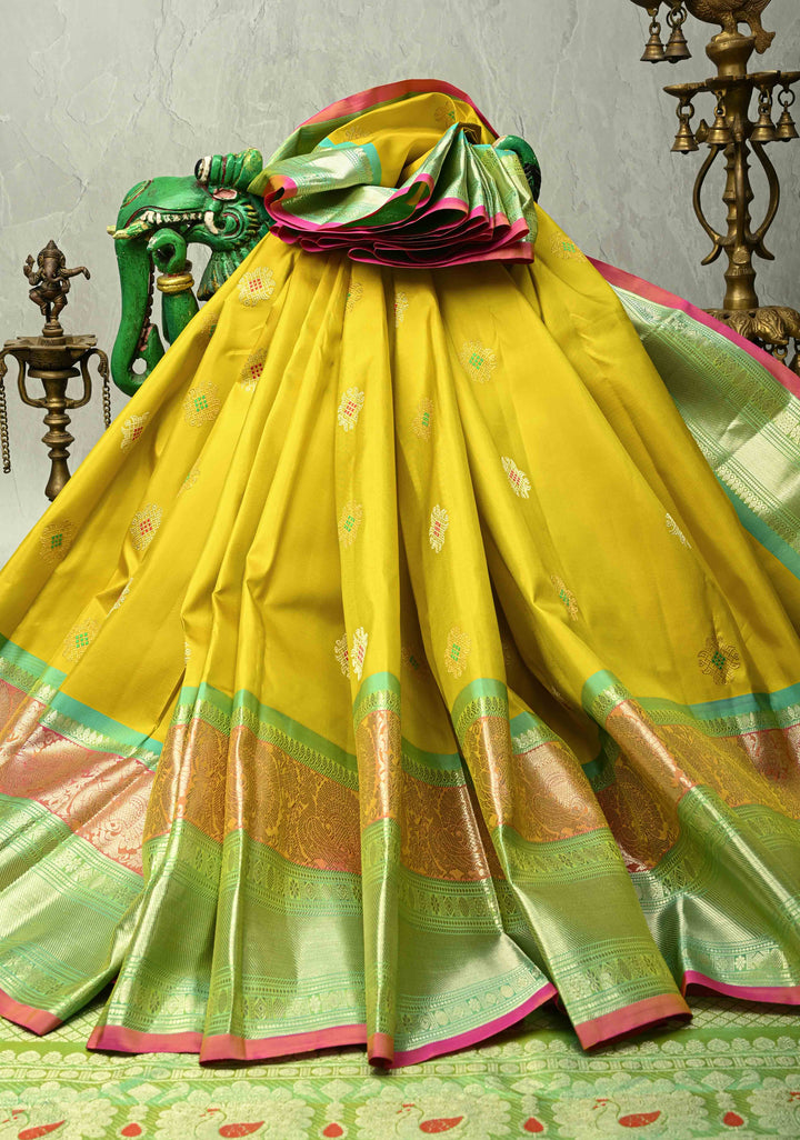 Yellow Gadwal Handwoven Pure Silk Saree with Meenakari Rangoli Zari Buttas with Pink and Teal Border | SILK MARK CERTIFIED