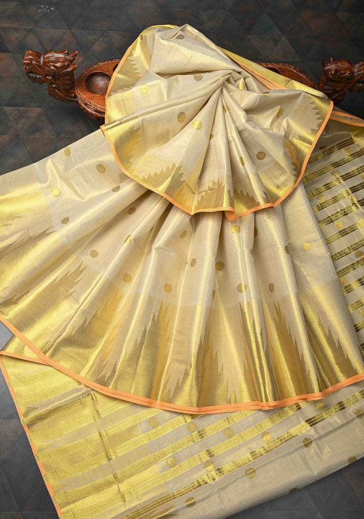 Beige Tissue Cotton Saree with Zari Coin Buttis And Temple Border