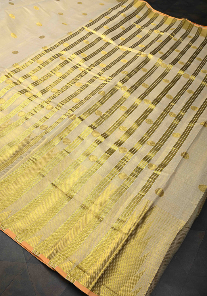 Beige Tissue Cotton Saree with Zari Coin Buttis And Temple Border