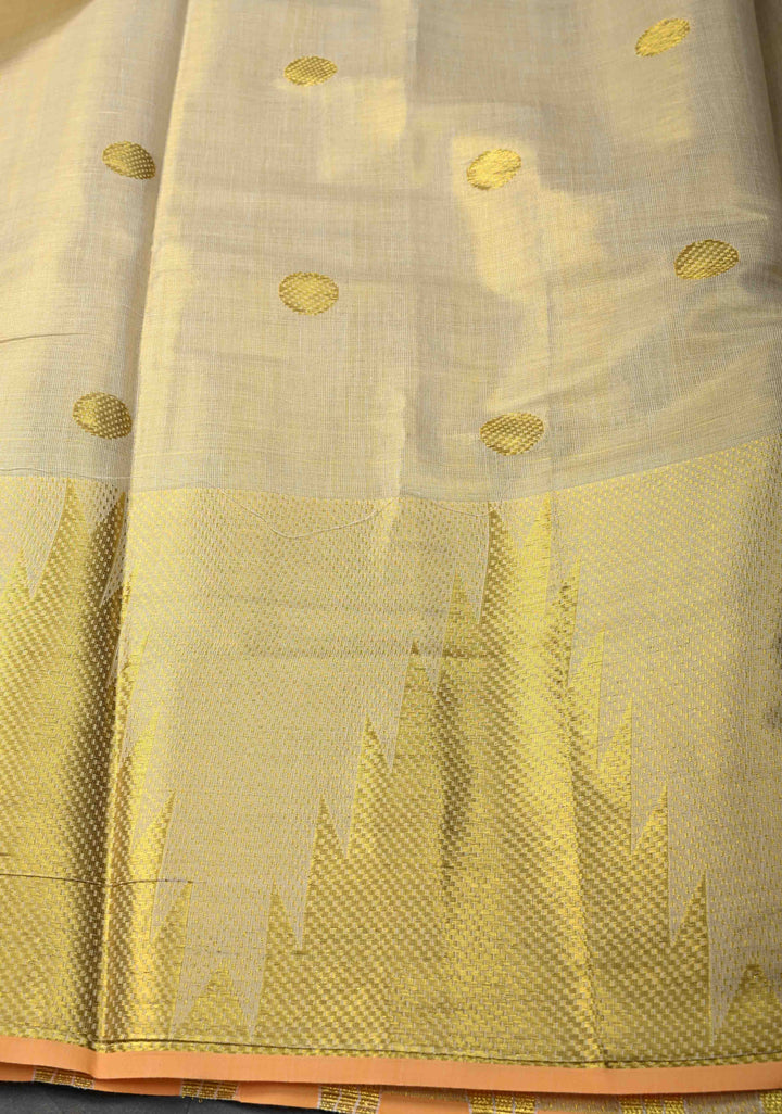 Beige Tissue Cotton Saree with Zari Coin Buttis And Temple Border