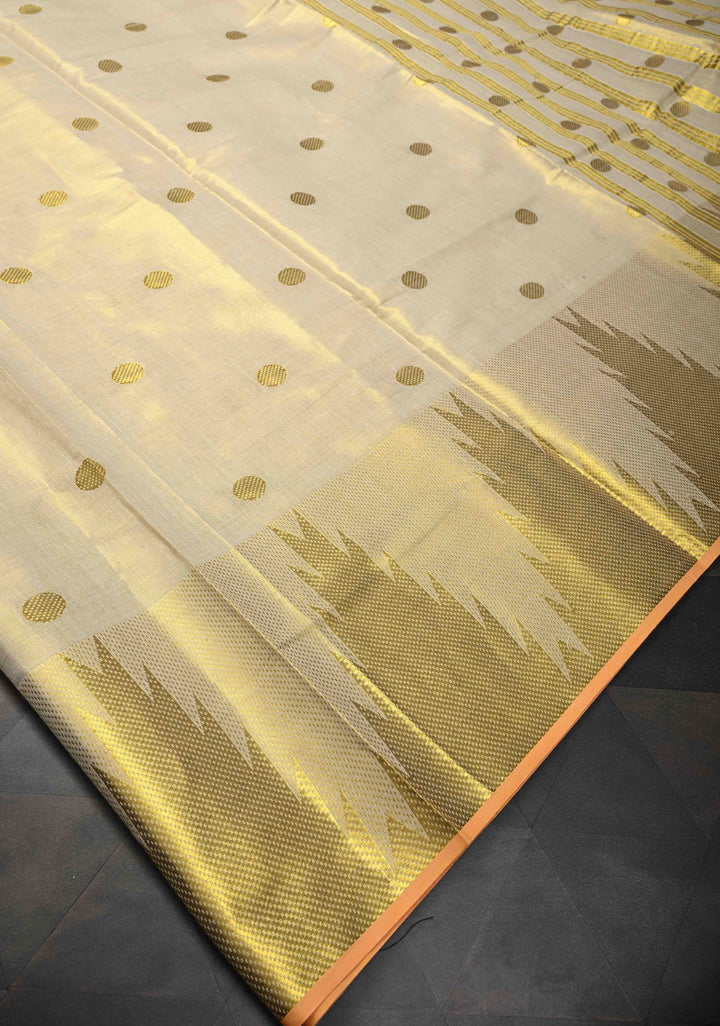 Beige Tissue Cotton Saree with Zari Coin Buttis And Temple Border