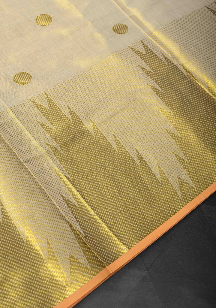 Beige Tissue Cotton Saree with Zari Coin Buttis And Temple Border