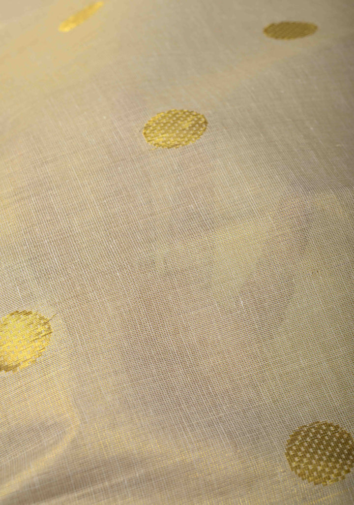 Beige Tissue Cotton Saree with Zari Coin Buttis And Temple Border