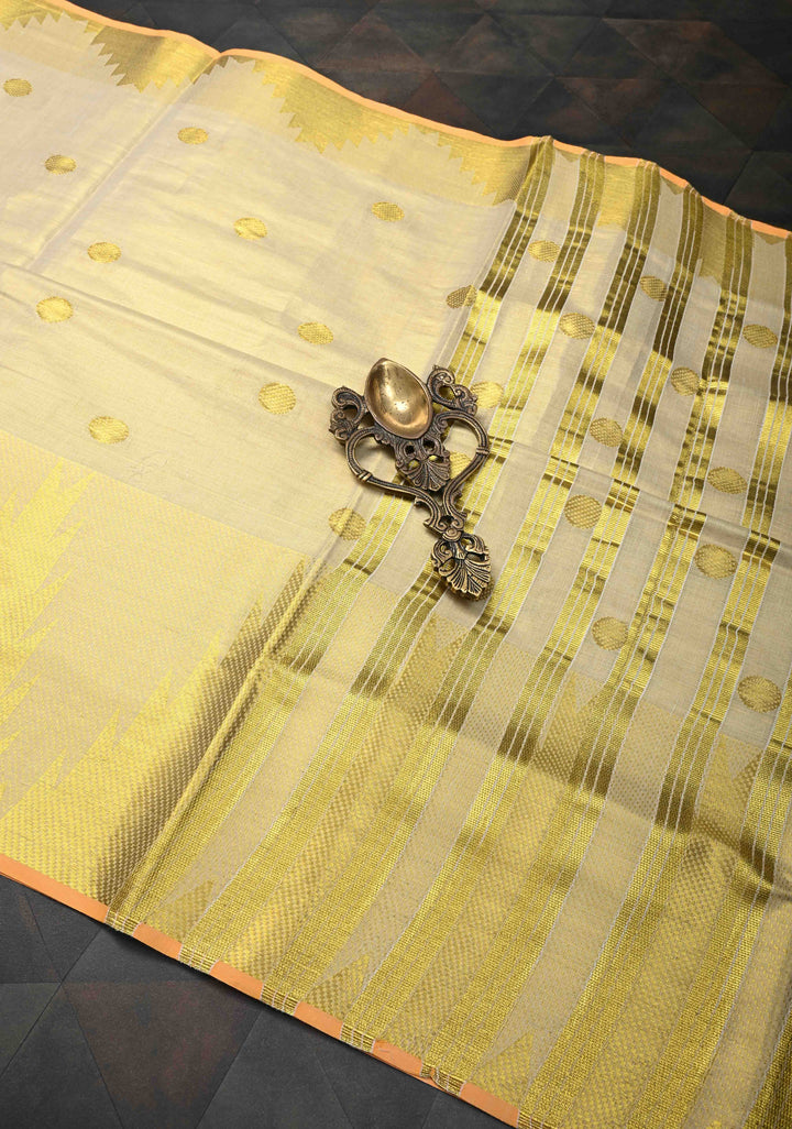 Beige Tissue Cotton Saree with Zari Coin Buttis And Temple Border