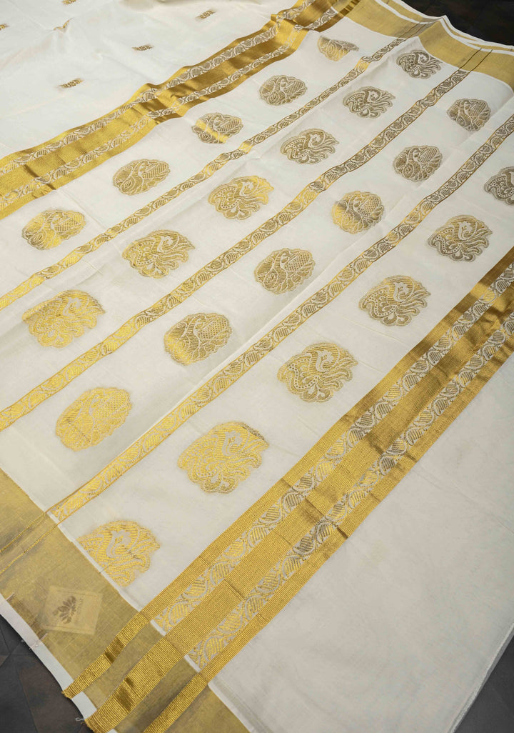 Off White Kerala Kasavu Cotton Saree with Floral Buttas and Zari Border