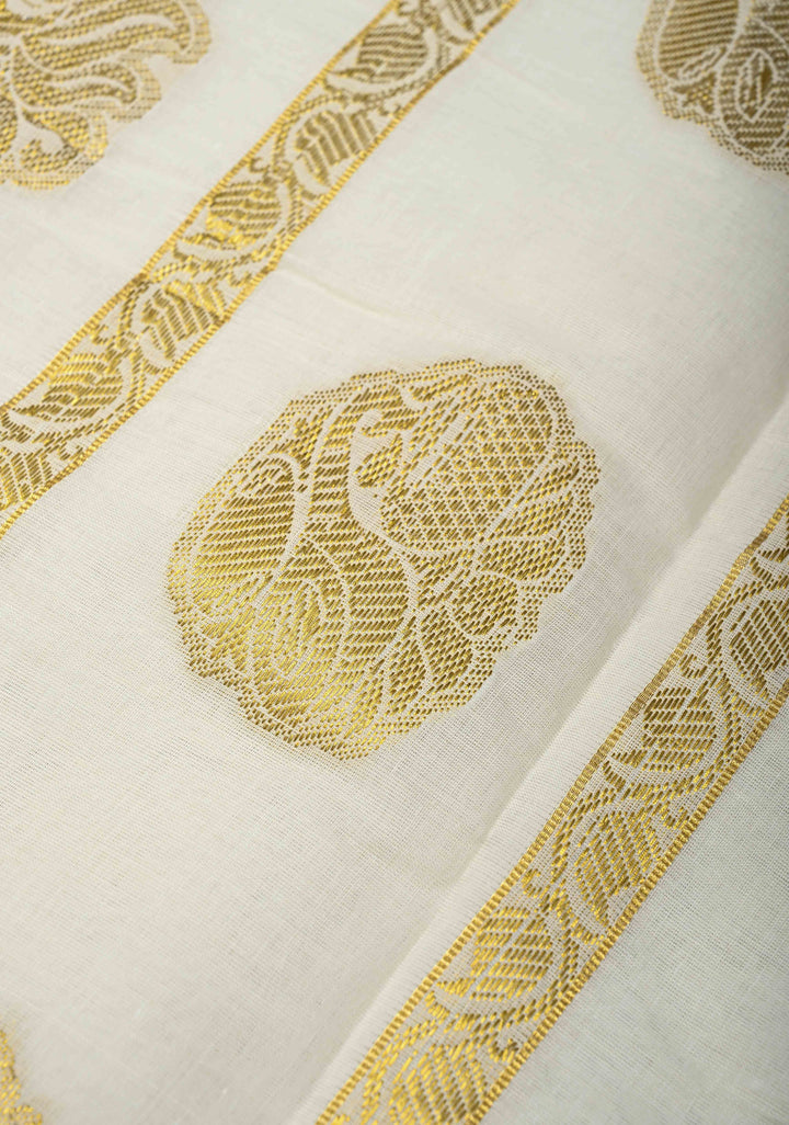 Off White Kerala Kasavu Cotton Saree with Floral Buttas and Zari Border