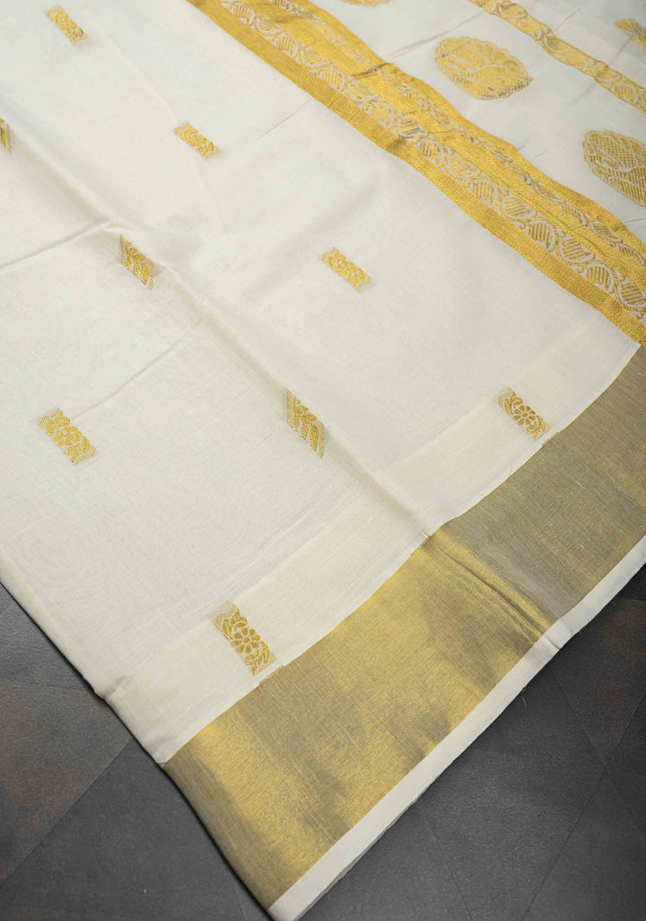 Off White Kerala Kasavu Cotton Saree with Floral Buttas and Zari Border