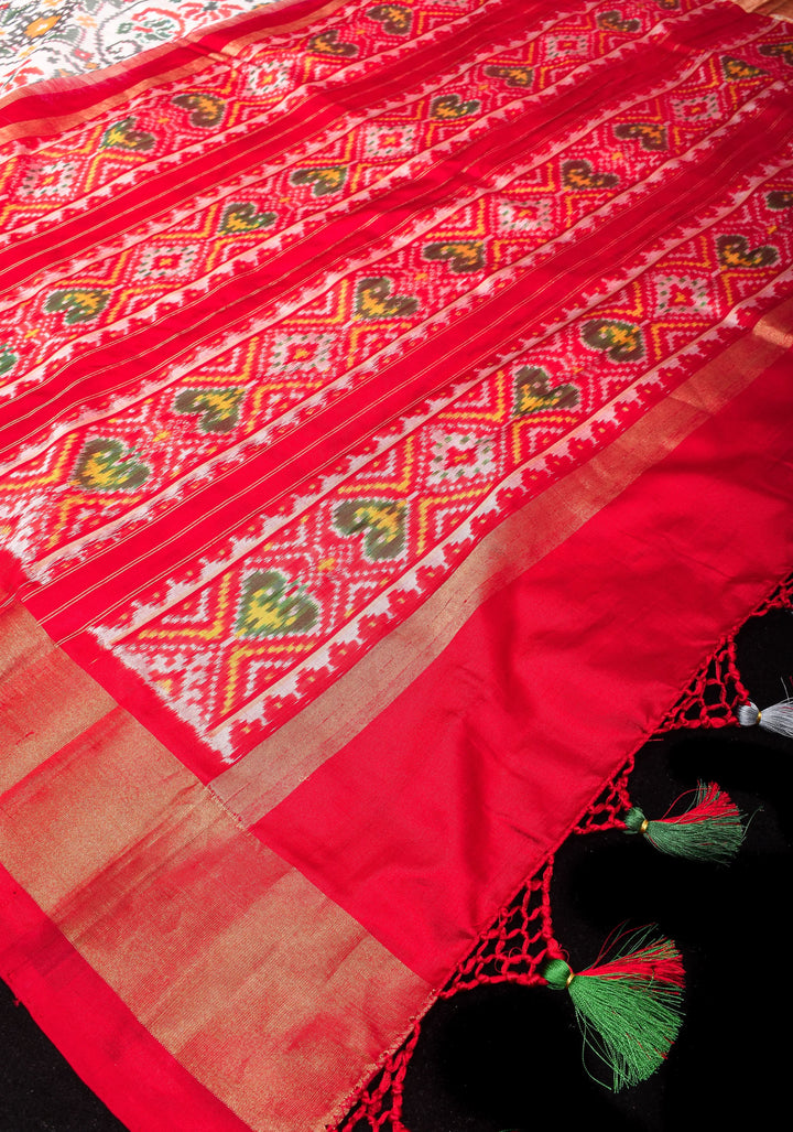 Exquisite Grand Ikkat Patola Pure Silk Saree in White with Contrast zari Border | SILK MARK CERTIFIED