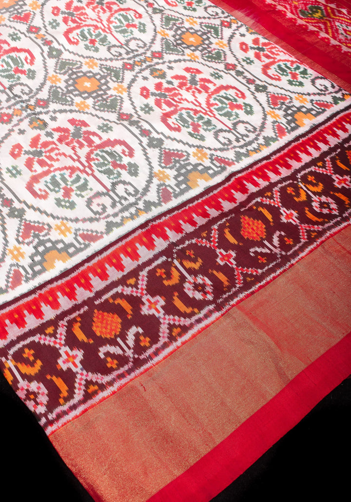 Exquisite Grand Ikkat Patola Pure Silk Saree in White with Contrast zari Border | SILK MARK CERTIFIED