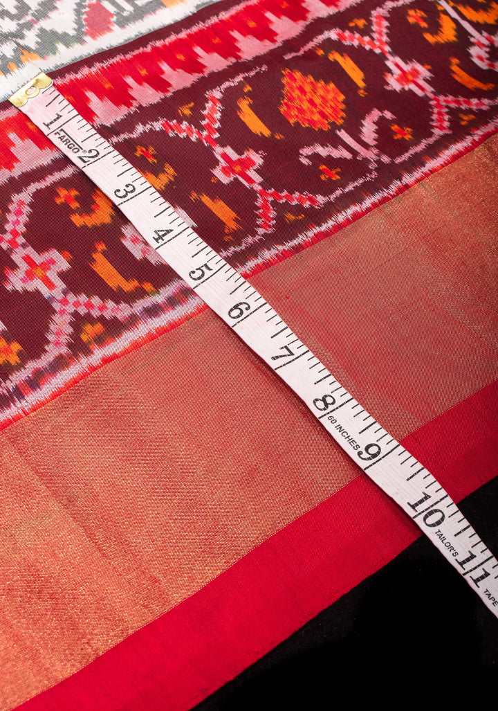 Exquisite Grand Ikkat Patola Pure Silk Saree in White with Contrast zari Border | SILK MARK CERTIFIED