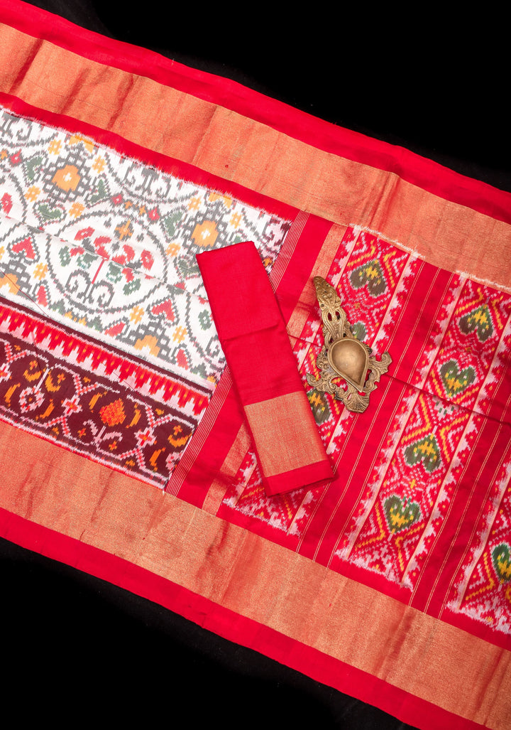 Exquisite Grand Ikkat Patola Pure Silk Saree in White with Contrast zari Border | SILK MARK CERTIFIED