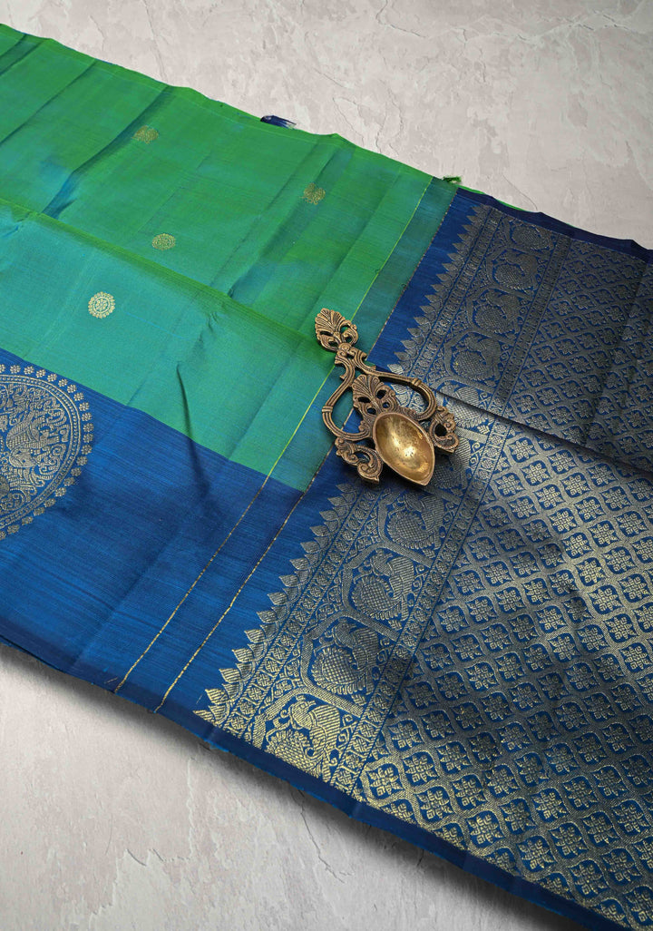 Green Dual tone Kanjivaram Pure silk saree with Zari Buttas and Distinct Vanasingaram Mandala Motifs on Contrast Border | SILK MARK CERTIFIED