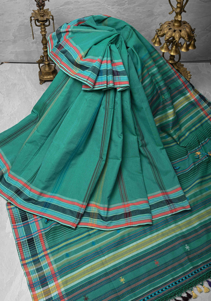 Green Handloom Bhujodi Kala Cotton Saree with buttas and honeycomb tassels