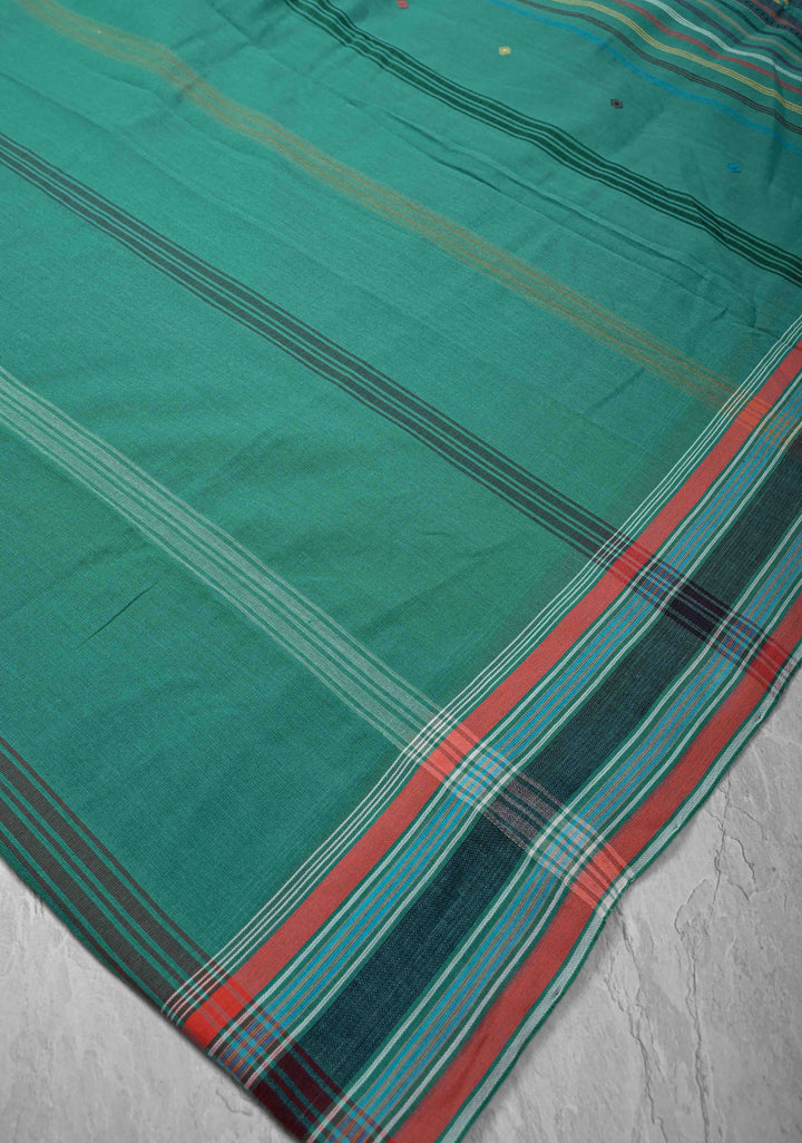 Green Handloom Bhujodi Kala Cotton Saree with buttas and honeycomb tassels
